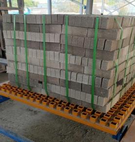 Full automatic cement brick stacking machine packing is completed automatically
